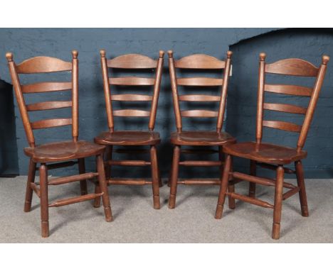 A set of 4 oak ladder back dining chairs.  