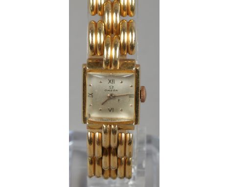 A ladies yellow metal Omega manual bracelet watch.  Running.