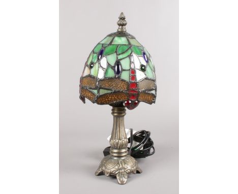 A Tiffany style dragon fly table lamp. (32cm height)  Some of the glass has cracked on the shade. item is working.