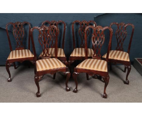 A set of six Mahogany Chippendale Style dining chairs. Comprising of upholstered striped seats. H:104cm,W:52cm, D:46cm.  Cond