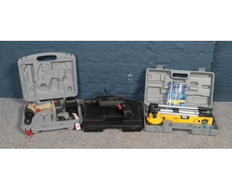 A collection of boxed tools - comprising of a 'Parkside' laser type spirt level, a Black &amp; Decker Quatro drill &amp; a Pe