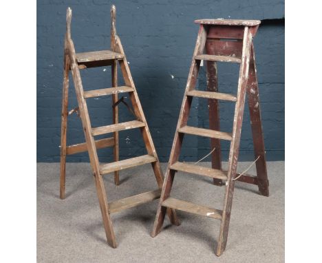 Two sets of decorators wooden step ladders.  