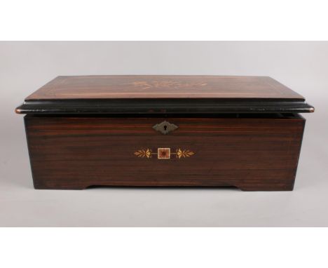 A late 18th C/Early 19th C Swiss inlaid Rosewood Music box. the hinged lid enclosing music box playing eight airs. (49cm widt