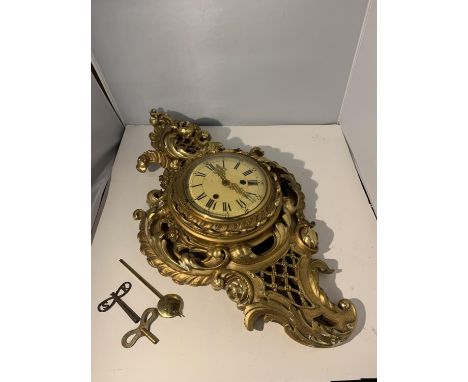 A GILDED CHIMING WALL CLOCK WITH ENAMEL FACE TO INCLUDE TWO KEYS (NEEDS RESTORING) 