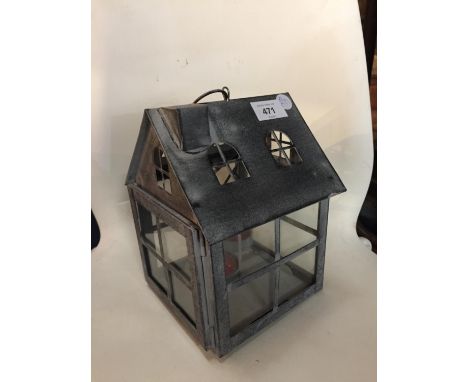A METAL GREENHOUSE TEA LIGHT HOLDER HEIGHT 21CM 