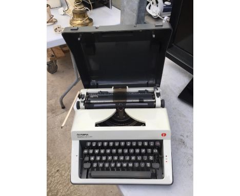 AN OLYMPIA MONICA DE LUXE CASED TYPEWRITER 