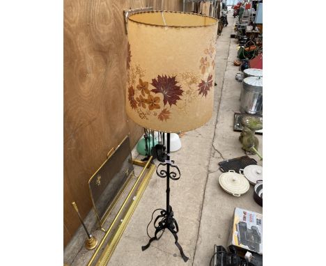 A DECORATIVE WROUGHT IRON STANDARD LAMP WITH SHADE 