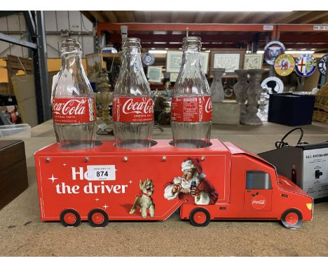 A COLLECTABLE LIGHT UP CHRISTMAS CARDBOARD COCA-COLA LORRY WITH THREE EMPTY COCA-COLA GLASS BOTTLES 