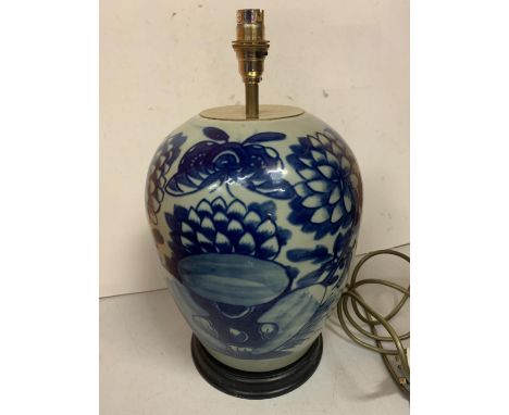 A LARGE ORIENTAL BLUE AND WHITE LAMP BASE 