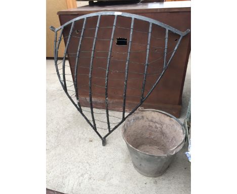 A VINTAGE CORNER HAYRACK AND A GALVANISED METAL BUCKET 