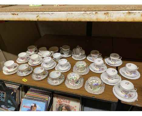 A QUANTITY OF VARIOUS DESIGNS OF BONE CHINA CUPS, SAUCERS AND PLATES 