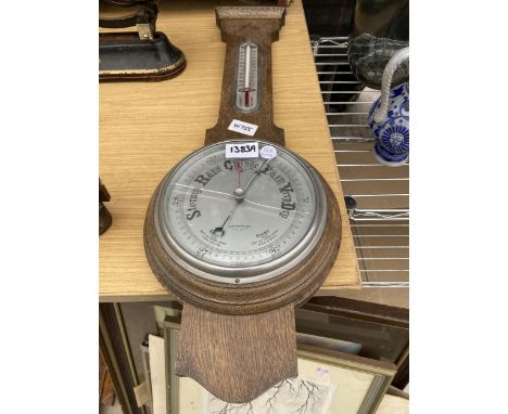 A VINTAGE WOODEN CASED BAROMETER 
