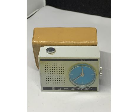 A VINTAGE MINIATURE SUMATIC ALARM CLOCK WITH CASE 