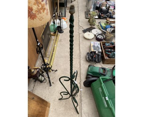 A DECORATIVE WROUGHT IRON STANDARD LAMP 