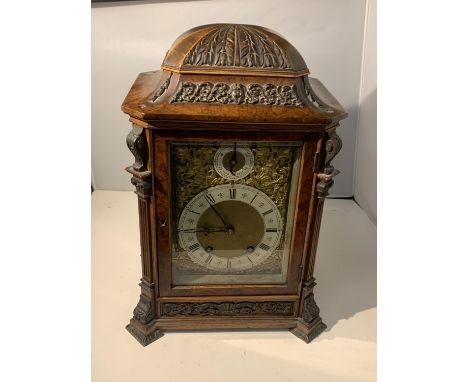 A LENZKIRCH WALNUT CHIMING BRACKET CLOCK WITH ELABORATE GILT FACE AND ENAMEL DIALS 
