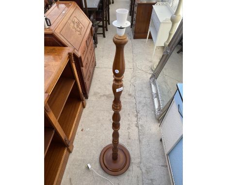 A MODERN STANDARD LAMP WITH TURNED COLUMN 