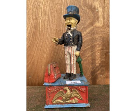 A VINTAGE CAST MECHANICAL MONEY BOX 