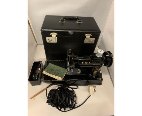 A VINTAGE 222K FEATHERWEIGHT SINGER PORTABLE ELECTRIC SEWING MACHINE WITH CASE, INSTRUCTIONS, PEDAL AND STORAGE BOX 
