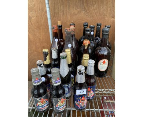 AN ASSORTMENT OF VINTAGE GLASS BOTTLES TO MAINLY CONSIST OF REAL ALE 