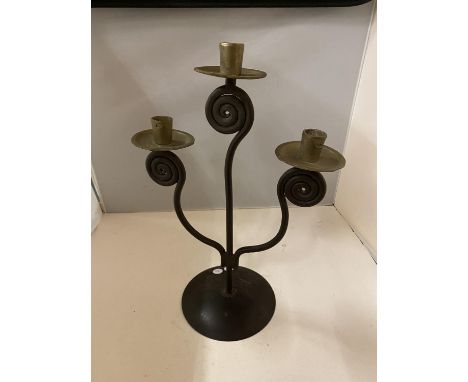 AN ARTS &amp; CRAFTS STYLE METAL CANDLESTICK FOR THREE CANDLES 