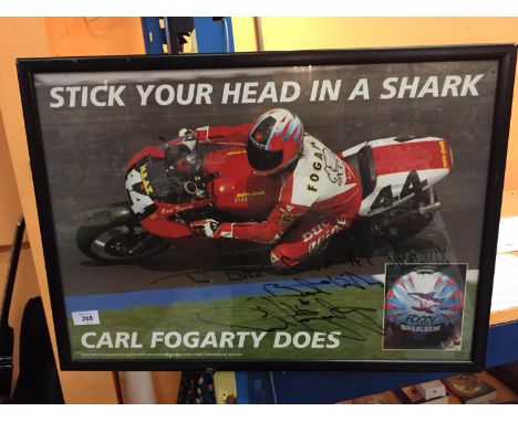 A FRAMED SIGNED PRINT OF CARL FOGARTY ADVERTISING SHARK HELMETS 