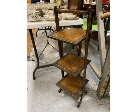 A VINTAGE SQUARE COLLAPSIBLE CAKE STAND WITH THREE TIERS HEIGHT 84CM 