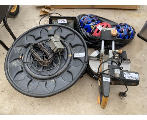AN ASSORTMENT ITEMS TO INCLUDE AN ELECTRIC CIRCULAR SAW BELIEVED IN WORKING ORDER BUT NO WARRANTY, BIKE HELMETS AND A FLOOD L