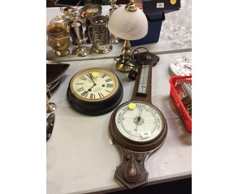 A MAHOGANY CASED ANEROID BAROMETER GLASS A/F, A VICTORIA STATION CLOCK AND A TABLE LAMP 