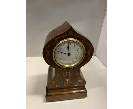 AN ART NOUVEAU STYLE MANTLE CLOCK WITH COPPER INLAY 