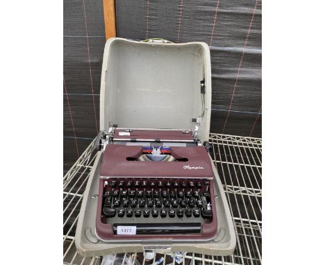 A CASED RETRO OLYMPIA DE LUXE TYPEWRITER STAMPED MADE IN WESTERN GERMANY 