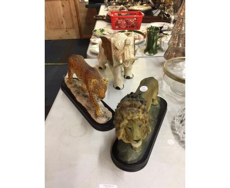 A CERAMIC LION, CHEETAH AND ELEPHANT 
