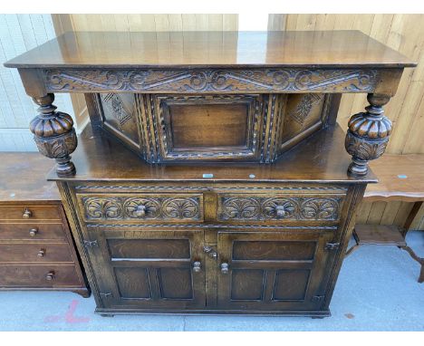 A GEORGIAN STYLE OAK COURT CUPBOARD BY RACKSTRAW (WORCESTER), HAVING TWO CARVED DRAWERS AND TWO PANELLED CUPBOARDS TO THE BAS