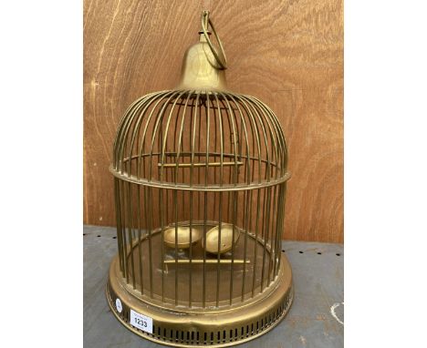 A VINTAGE BRASS BIRD CAGE WITH TWO PERCHES AND FEED BOWLS 