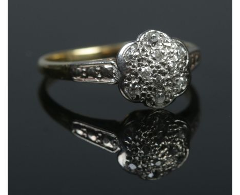 A vintage 18ct gold and platinum diamond cluster ring. Hallmarks for Birmingham 1978. Size P 1/2. 3.97g.  