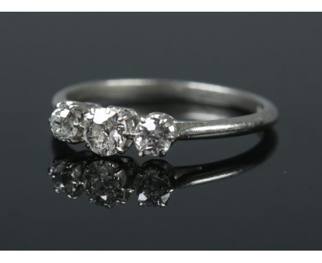 An early 20th century platinum three stone diamond ring. Size M. 2.45g.  