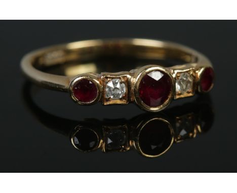 An 18ct ruby and diamond five stone ring. Size P 1/2. 2.52g.  