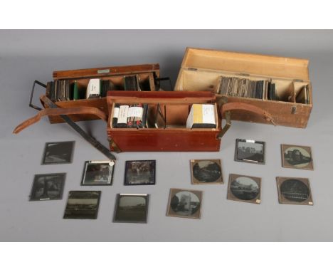 Three cases of photographic magic lantern slides including subjects such as the Middle East, London landmarks, tribes, etc.  