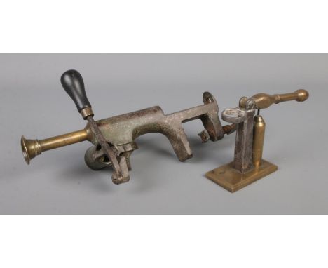 Antique cartridge reloading tools. Includes capper and reloading press.  