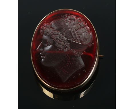 After Filippo Rega, a paste intaglio brooch with portrait of Emma, Lady Hamilton, in 15ct gold mount. Initialled under portra