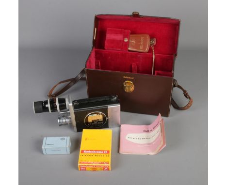 A Bell &amp; Howell 16mm Cine Camera in original leather carry case with accessories such as manual and Zeiss Ikon Ikophot.  