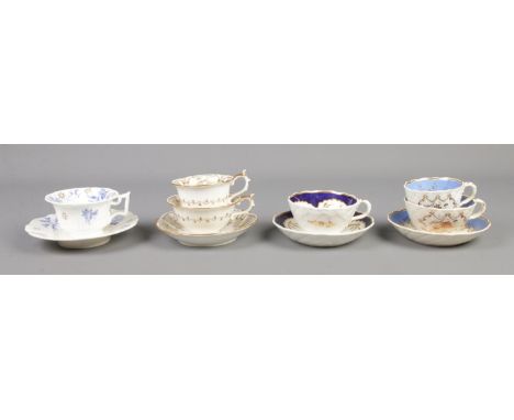 A collection of Rockingham porcelain tea wares. Includes cup and saucer with red griffin mark along with cup and saucer and t