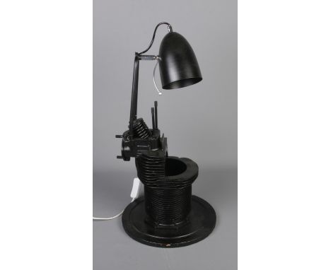 Upcycled lamp constructed from plane engine part  