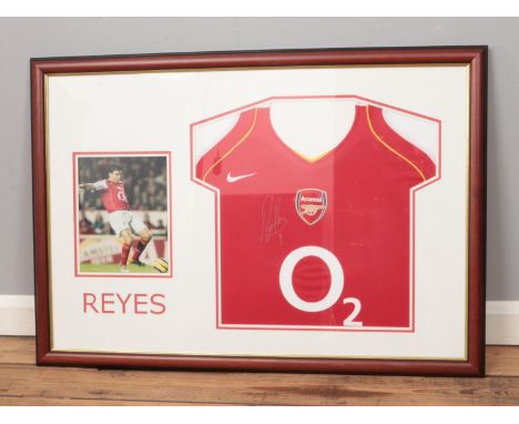 A signed Jose Antonio Reyes Arsenal football shirt mounted in display frame. Approx. frame dimensions 93cm x 65cm. Having Cer