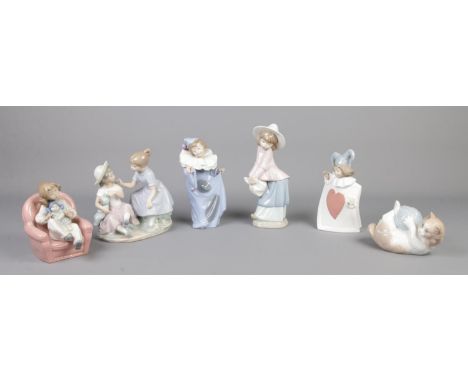 Six Nao by Lladro ceramic figures, including cat with ball of string and mother and child on chair.  Third figure has a chip 