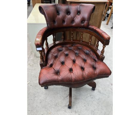 A RED LEATHER BUTTON BACK CHESTERFIELD CAPTAIN'S ARMCHAIR 