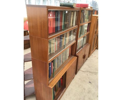 TWO RETRO 'MINTY' SLIDING DOOR BOOKCASES WITH UPPER GLAZED PANELS, TOGETHER WITH A LARGE QUANTITY OF VINTAGE CLOTH BOUND BOOK