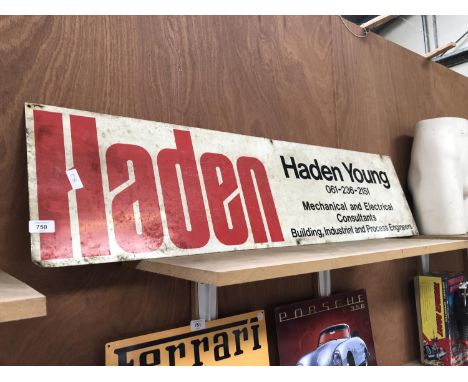 A LARGE ENAMEL 'HADEN YOUNG' SIGN 