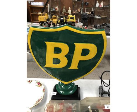 A LARGE METAL 'BP' SIGN ON BASE 