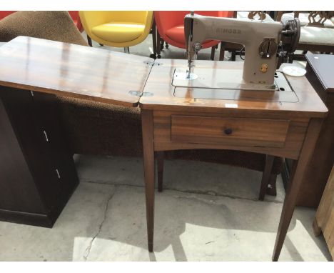 A VINTAGE MAHOGANY SINGER SEWING MACHINE TABLE 