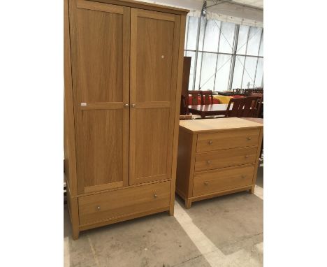 A MODERN LIGHT WARDROBE AND CHEST OF THREE DRAWERS 
